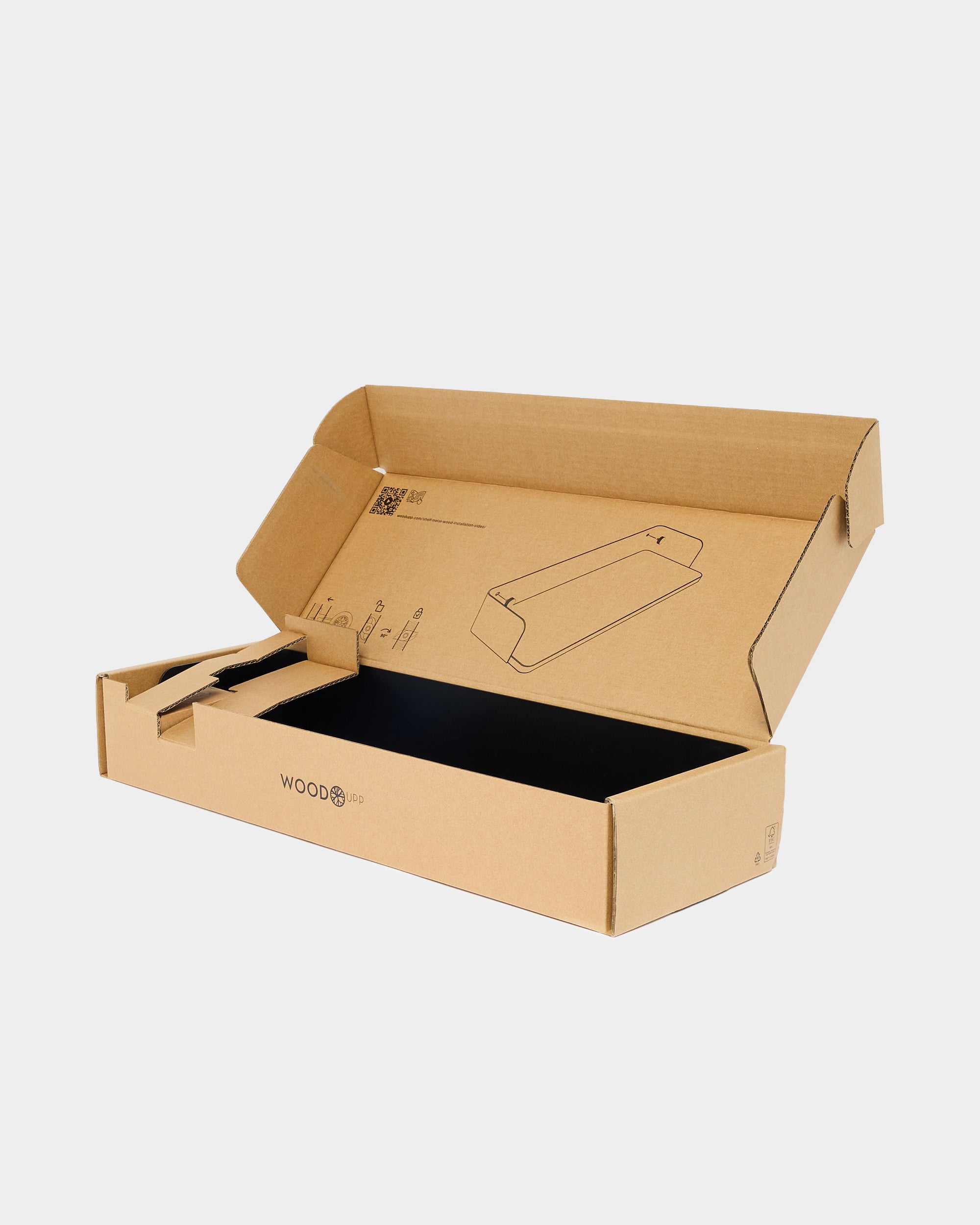 Open brown cardboard box with black interior, displaying simple line drawings and eco-friendly WOODBO logo, used for packaging WoodUpp acoustic panels.